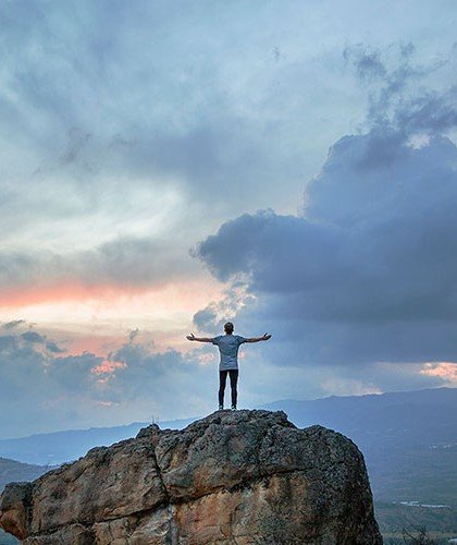 Man on top of a cliff