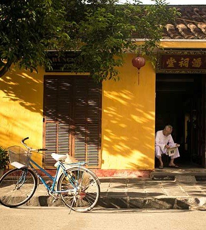 Old man reading newspaper