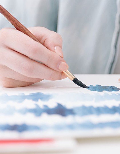 Artist painting with brush
