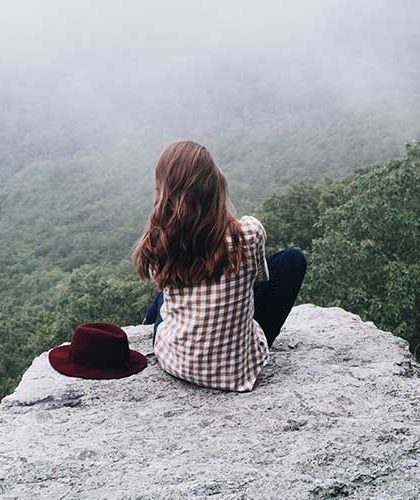 Girl alone on the rock