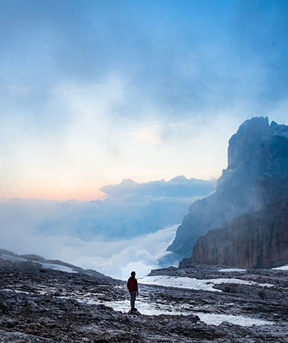 Man alone on icy rock