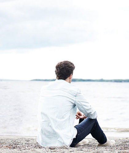 Man on the shore thinking