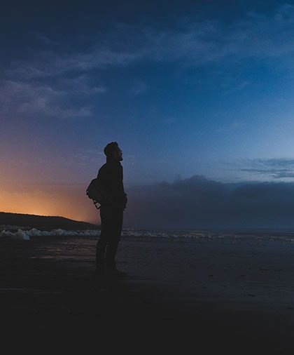 Man standing by the beach