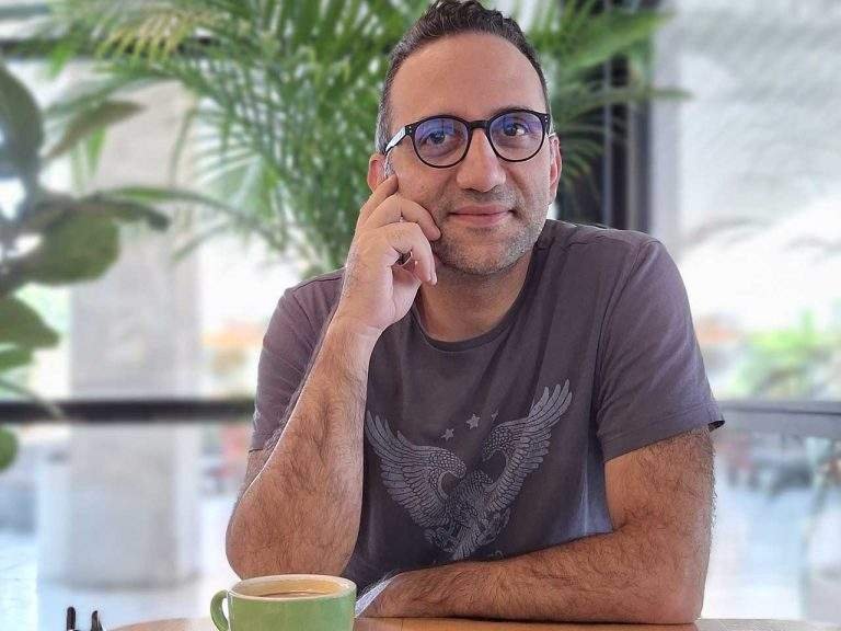 Aydin sitting at a cafe